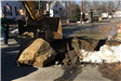Sewer Foreman Tom Joyce supervises the excavation of a large boulder on Ward Street
